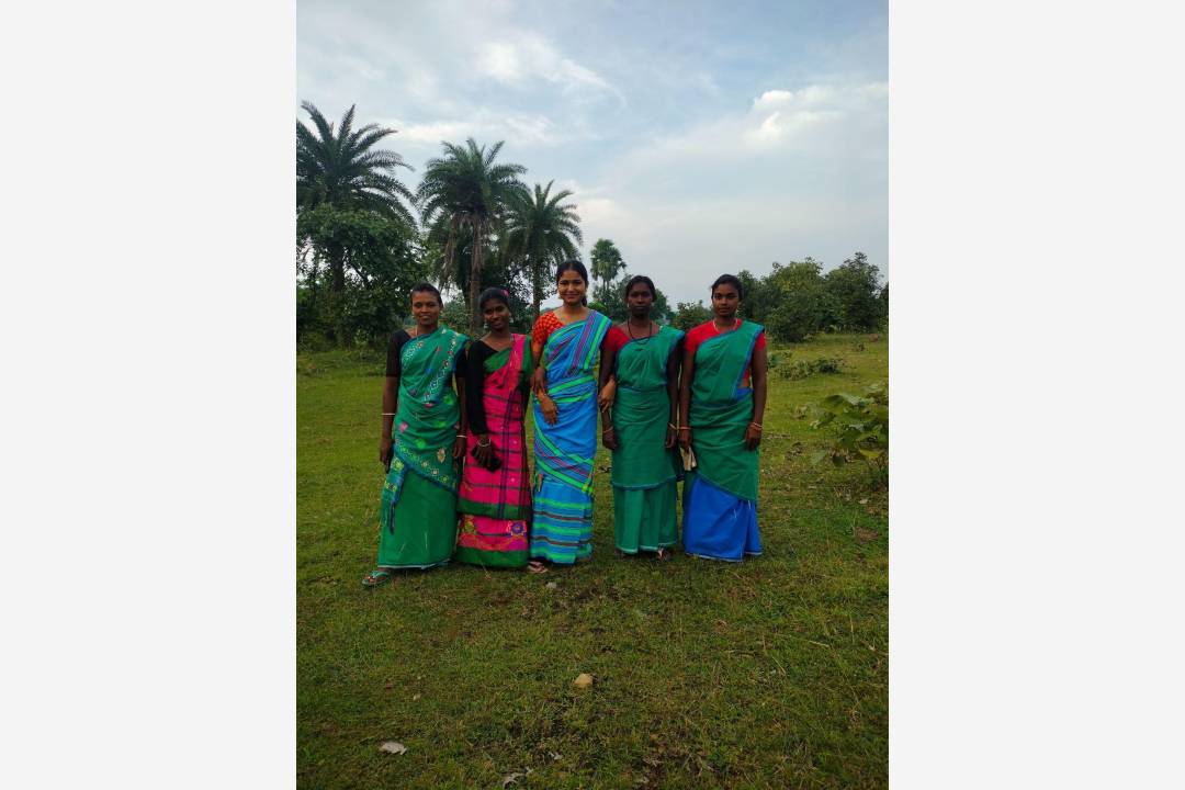Ishita with other community members wearing Panchi lungi